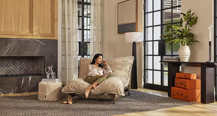 Lady sitting in PillowSac Accent Chair