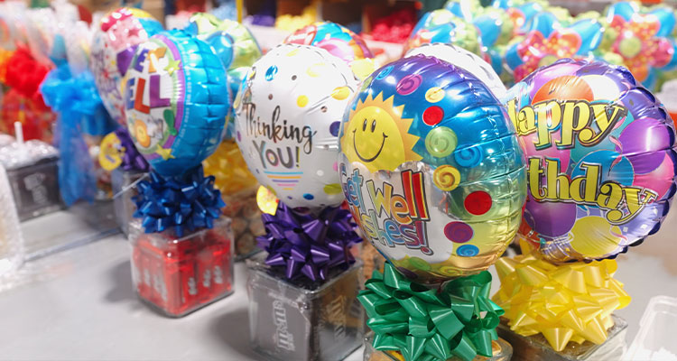 foil balloon bouquets with various messages such as "Happy Birthday," "Get Well Soon," and "Thinking You!".