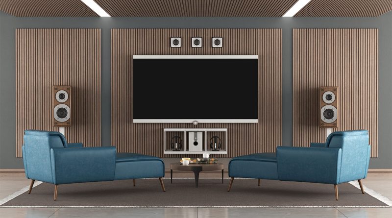 Modern home theater setup with surround speakers and a large screen projector in a darkened room