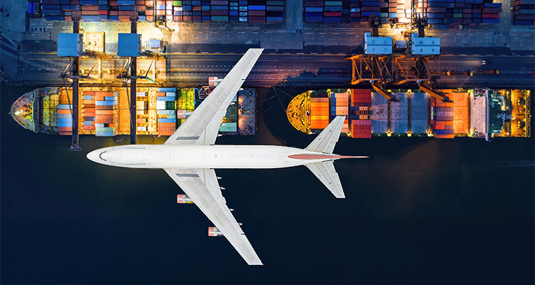 a composite showing an airplane flying over a cargo port at night